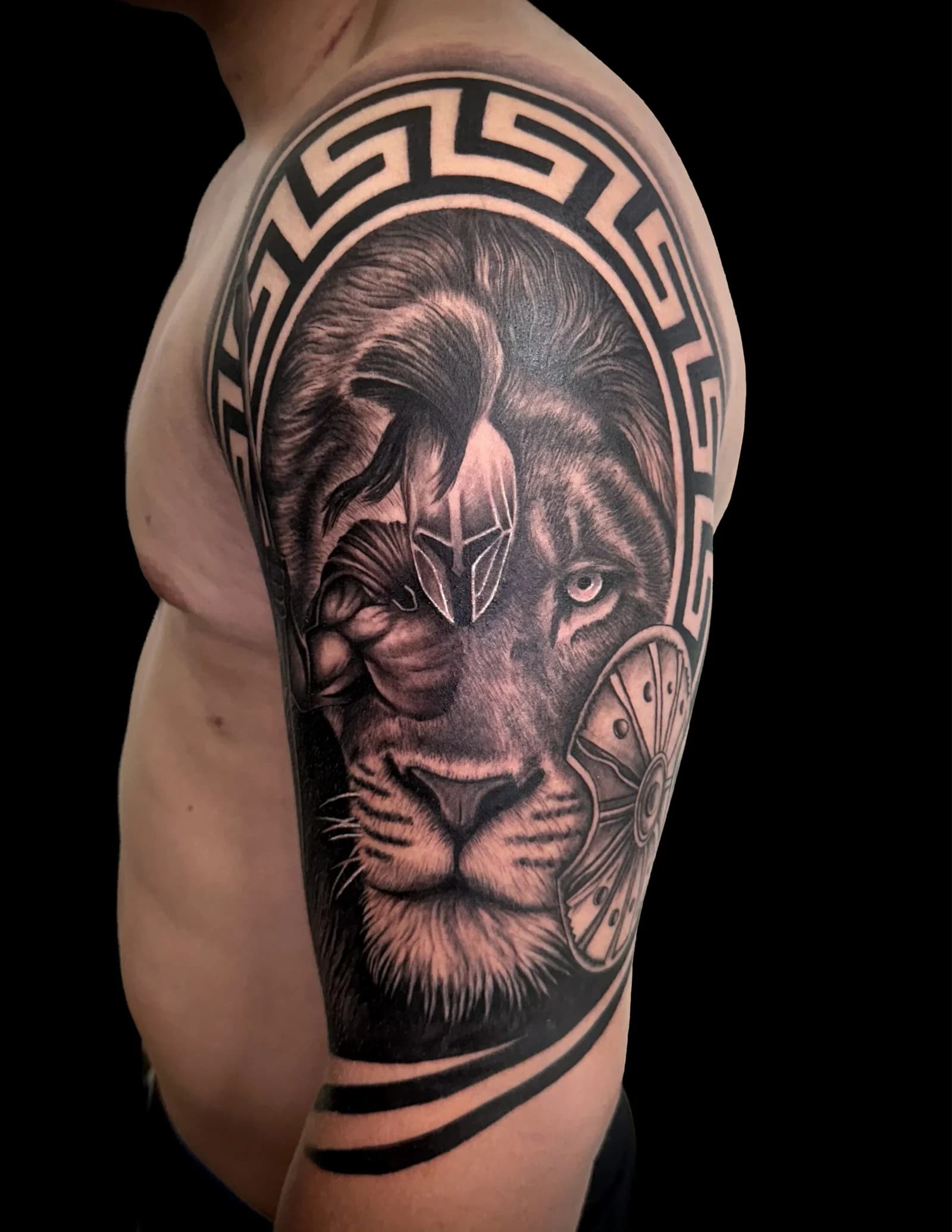 Spartan helmet and lion shoulder piece — black & gray realism